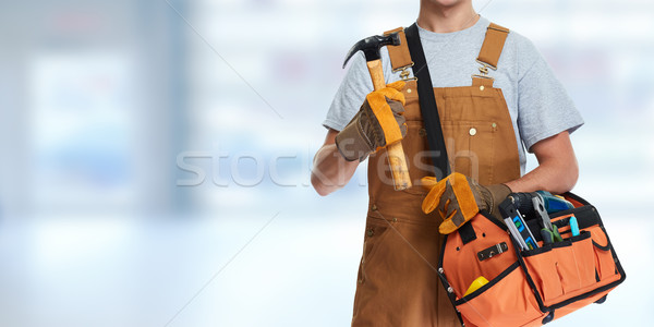 Construction worker with hammer. Stock photo © Kurhan