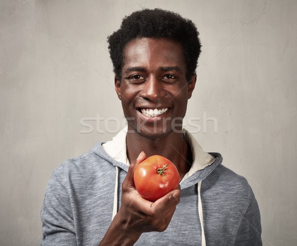 Black man with tomato. Stock photo © Kurhan