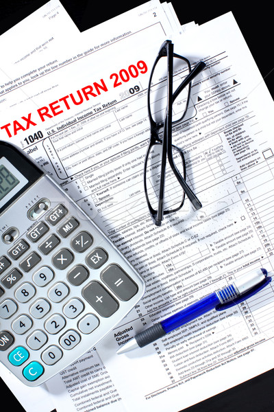 Stock photo: Tax form, calculator, pen