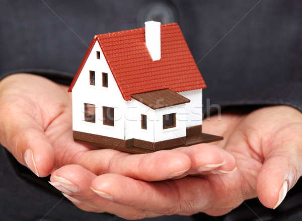 Hands with little house. Stock photo © Kurhan