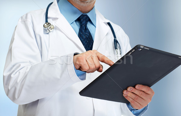Doctor hands with tablet computer Stock photo © Kurhan