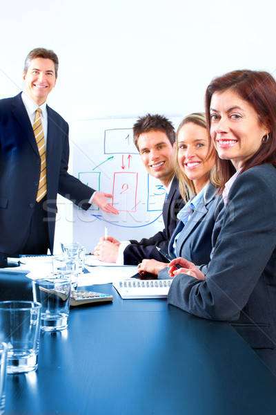 üzleti csapat mosolyog üzletemberek csapat dolgozik iroda Stock fotó © Kurhan