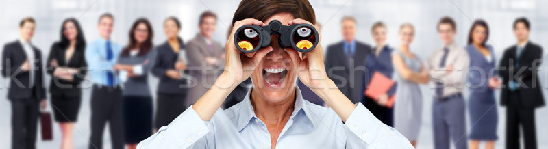 Business woman with binoculars. Stock photo © Kurhan