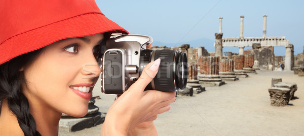 Stock photo: Tourist woman with a camera.