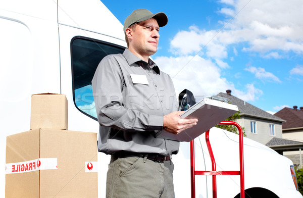 Delivery postal service man. Stock photo © Kurhan