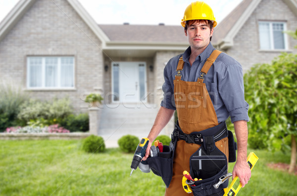 Builder handyman near new house. Stock photo © Kurhan