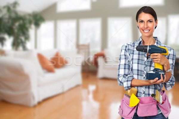 Young woman with a drill. Stock photo © Kurhan