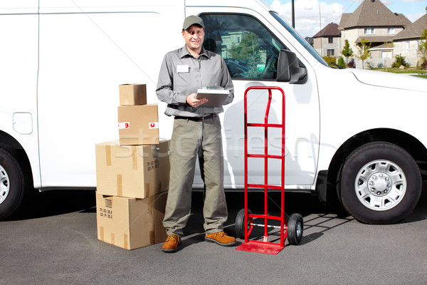 Smiling delivery courier. Stock photo © Kurhan