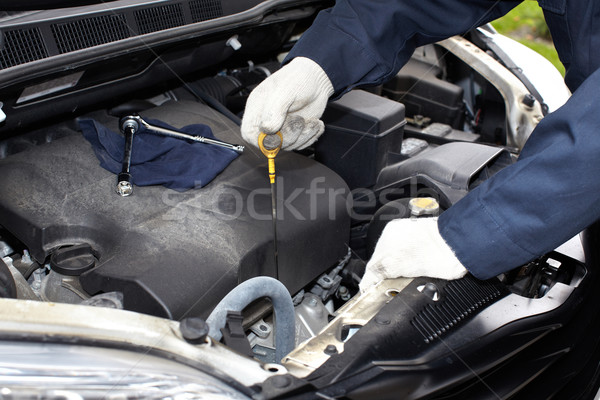 Hands of auto mechanic oil checking. Stock photo © Kurhan