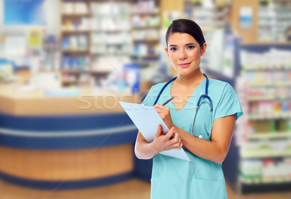 Foto stock: Hermosa · médico · mujer · sonriendo · azul · hospital