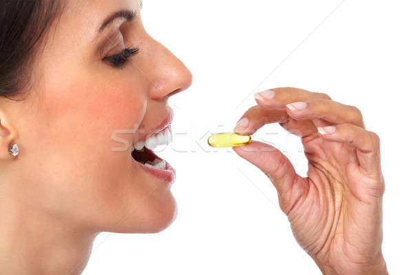 Femme orale pilule main visage Photo stock © Kurhan