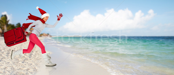 Happy running girl with a suitcase. Stock photo © Kurhan