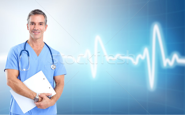 Medical doctor cardiologist. Over cardio background. Stock photo © Kurhan