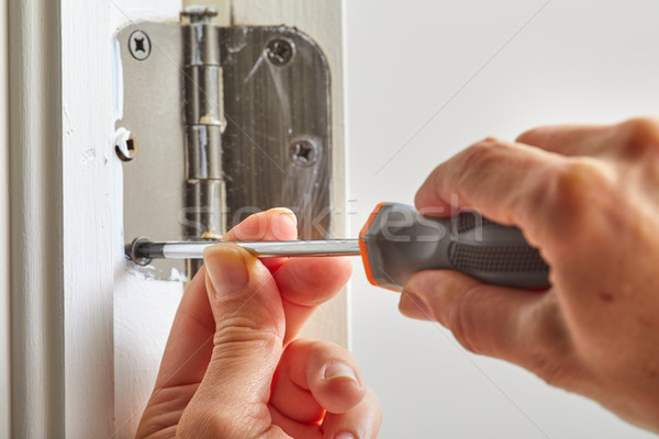 Stock photo: Door hinge installation.