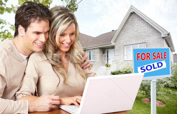 Couple with laptop near new house. Stock photo © Kurhan