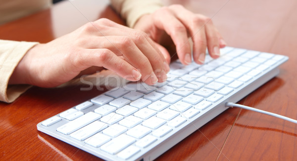 Woman typing Stock photo © Kurhan