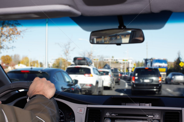 Hand of man driving on a highway. Stock photo © Kurhan