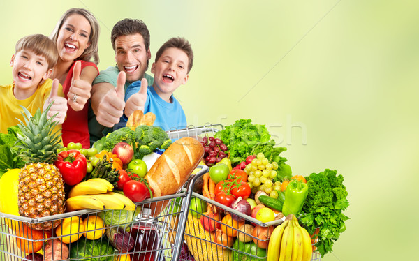 Boldog család élelmiszer bevásárlókocsi zöld absztrakt nő Stock fotó © Kurhan