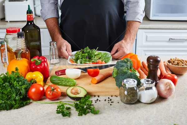 Chef man cooking in the kitchen. Stock photo © Kurhan