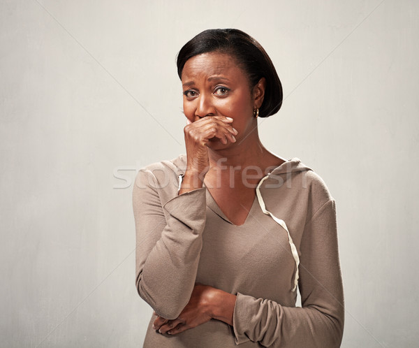 Undor afroamerikai nő gusztustalan arc kéz Stock fotó © Kurhan