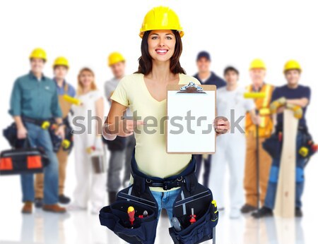 Stock photo: Contractor woman and group of industrial workers.