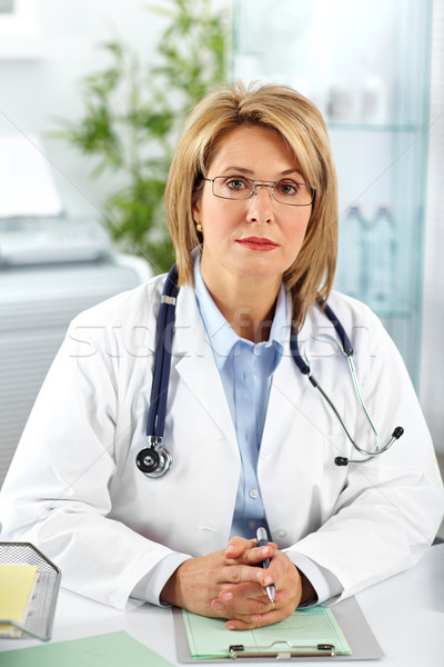 Stock photo: Mature doctor woman in a clinical office.