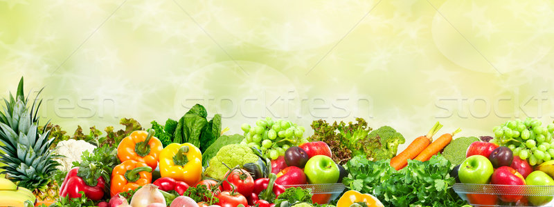 Vegetables and fruits over green background. Stock photo © Kurhan
