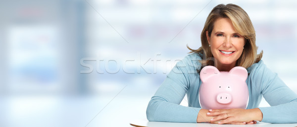 Senior woman with a piggy bank. Stock photo © Kurhan