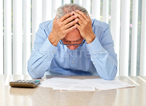 Elderly man with papers. Stock photo © Kurhan