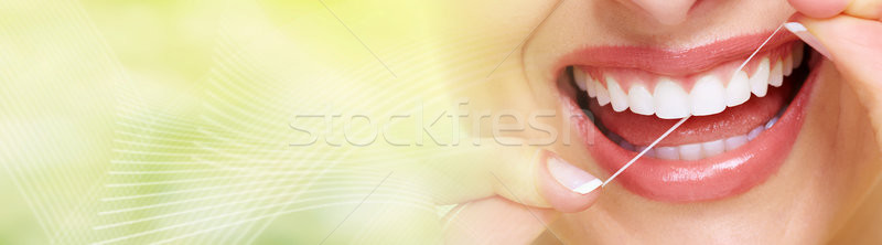woman flossing teeth Stock photo © Kurhan