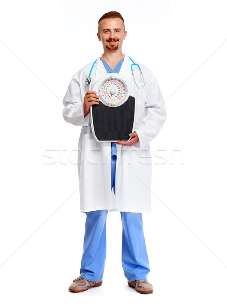 врач диетолог Весы изолированный белый медицинской Сток-фото © Kurhan