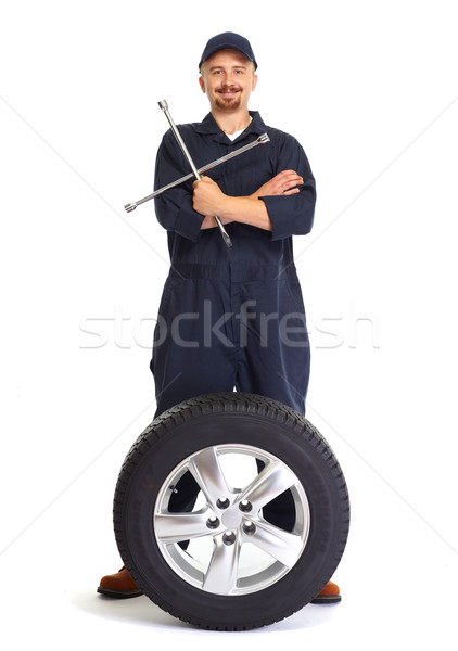 [[stock_photo]]: Voiture · mécanicien · pneu · clé · souriant · isolé