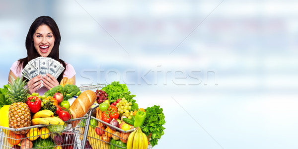 幸せ 若い女性 食料品 ショッピングカート アメリカン ドル ストックフォト © Kurhan