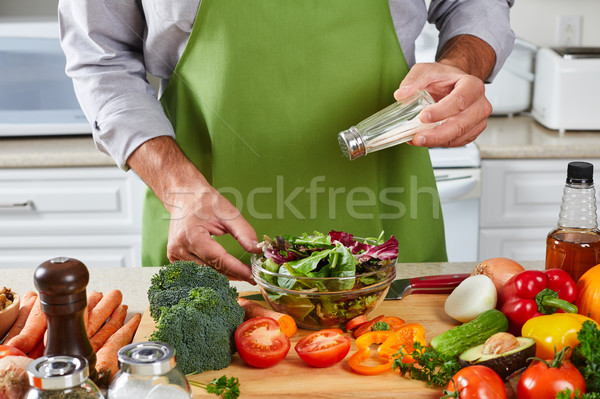 Chef man cooking in the kitchen. Stock photo © Kurhan