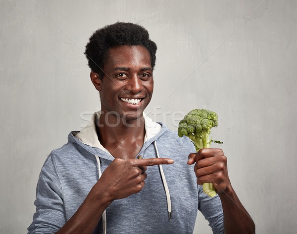 Black man with broccoli Stock photo © Kurhan