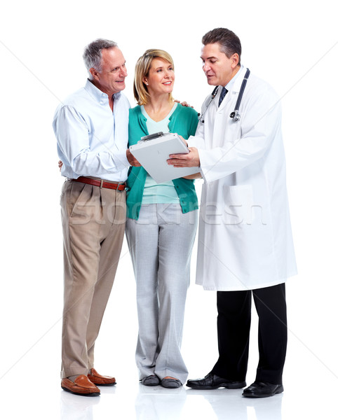 Foto stock: Pareja · de · ancianos · médico · sonriendo · médicos · aislado · blanco