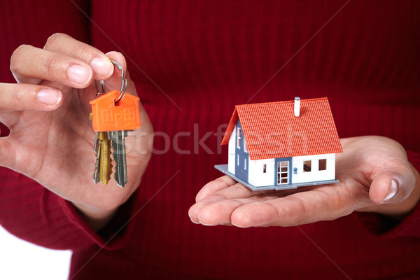 Woman Hands with little house and key. Stock photo © Kurhan