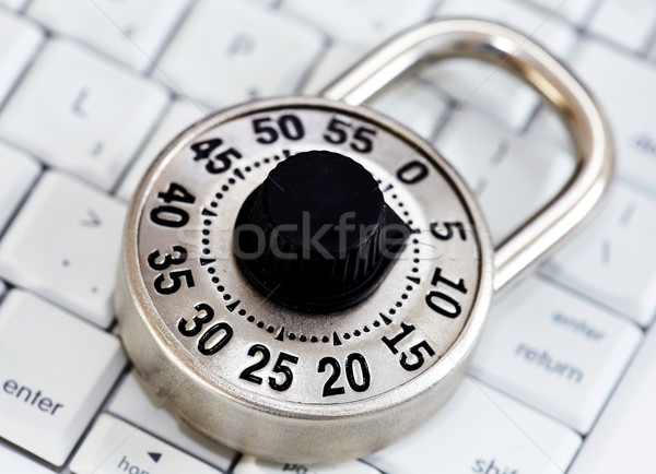 Stock photo: Lock with keyboard.