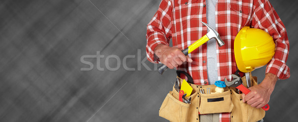 Builder handyman with construction tools. Stock photo © Kurhan