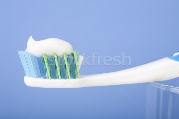 Stok fotoğraf: Diş · fırçalamak · mavi · arka · plan · dişler · temizlik