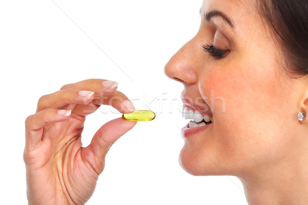 Woman with oral pill. Stock photo © Kurhan