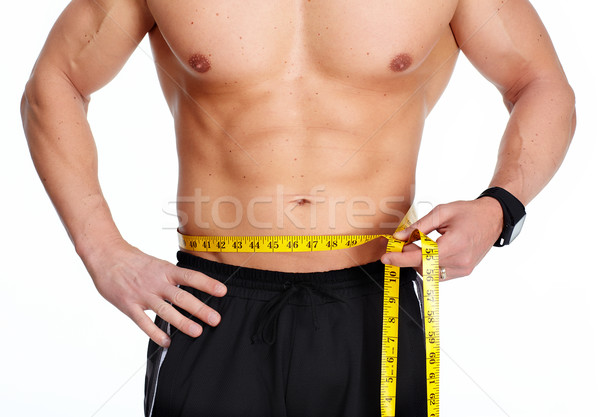 Hombre abdomen cinta métrica azul fuerte Foto stock © Kurhan