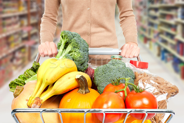 Woman with shopping cart. Stock photo © Kurhan