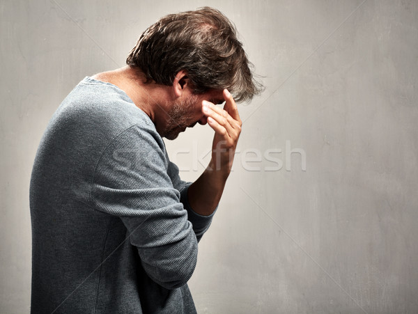 Solitário homem deprimido retrato cinza parede Foto stock © Kurhan