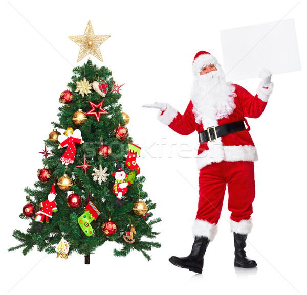 Santa Claus and Christmas tree. Stock photo © Kurhan