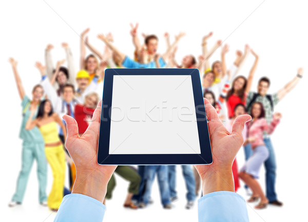 Tablet computer and group of happy people. Stock photo © Kurhan