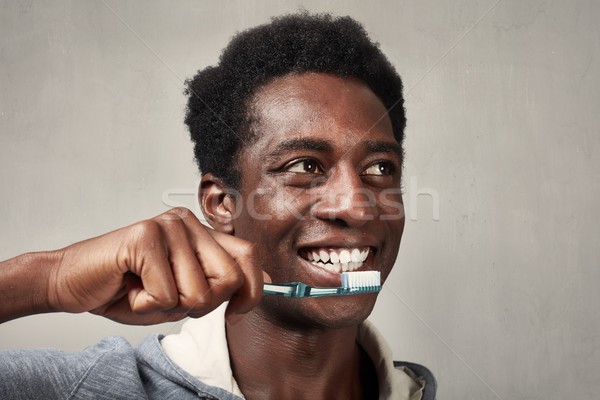 Man with toothbrush. Stock photo © Kurhan