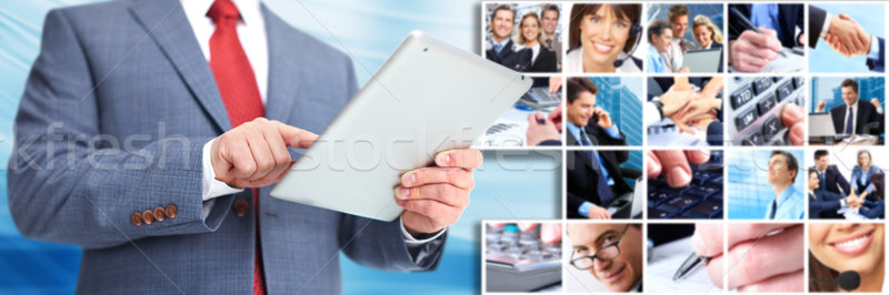 Businessman with an ipad computer. Stock photo © Kurhan