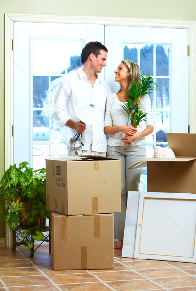 Happy couple moving in a new house. Stock photo © Kurhan