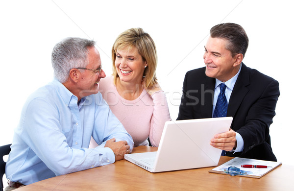 Senior couple with financial adviser. Stock photo © Kurhan